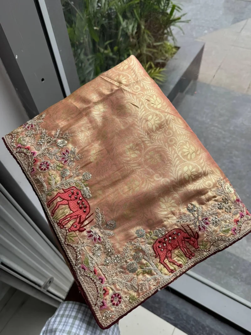 Peach Kanjivaram Silk Heavy Embroidered Wedding Saree in hand