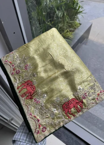 Pista Kanjivaram Silk Heavy Embroidered Wedding Saree in hand