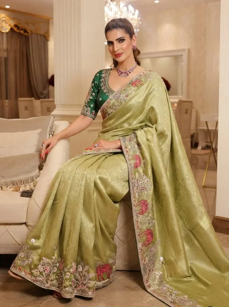 Pista Kanjivaram Silk Heavy Embroidered Wedding Saree sitting pose