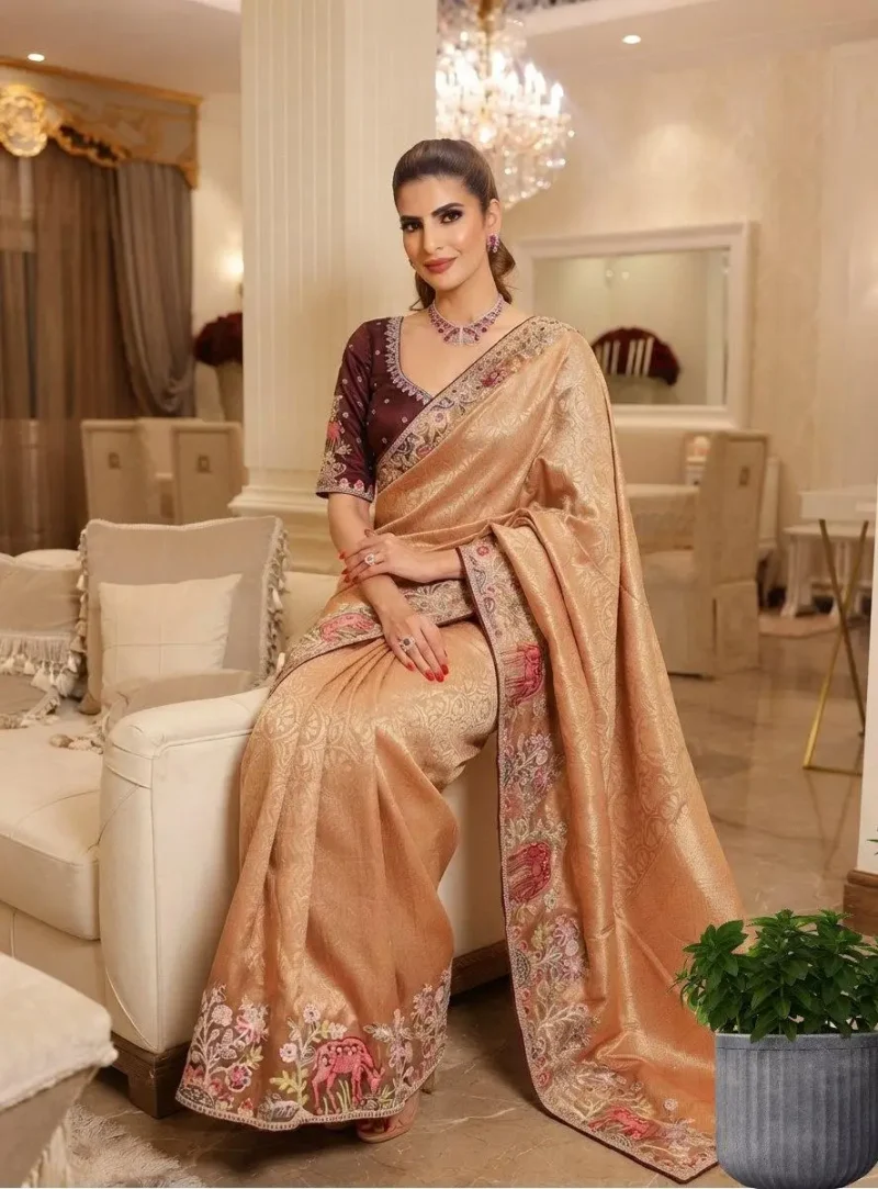 Pastel Kanjivaram Silk Heavy Embroidered Wedding Saree sitting pose