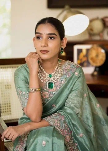 Teal Pure Soft Tissue Silk Party Wear Saree close sitting pose