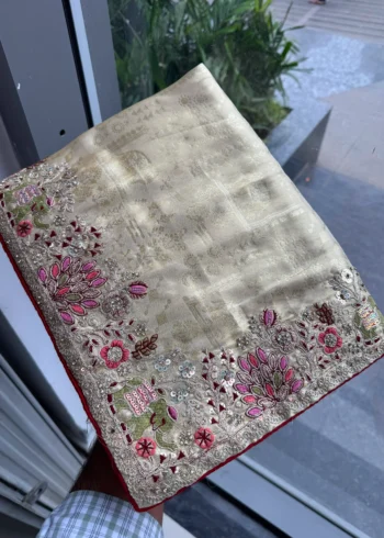 Beige Royal Hathi Pure Kanjivaram Silk Heavy Embroidered Bridal Saree in hand