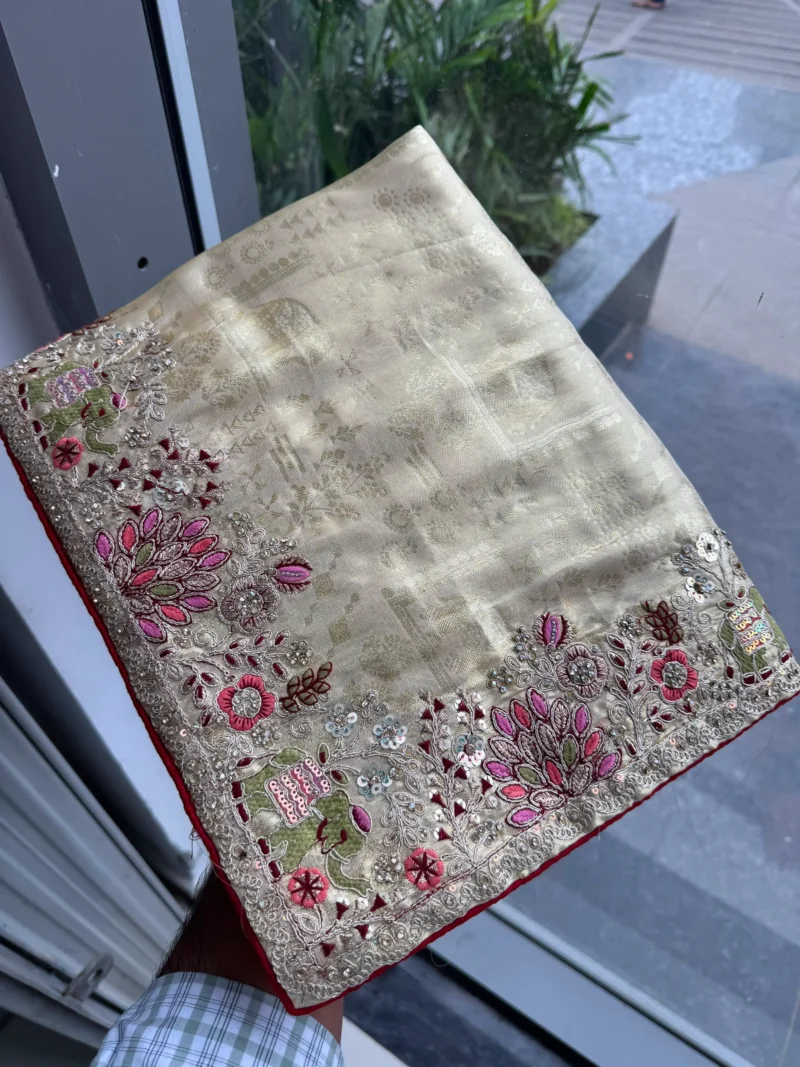 Beige Royal Hathi Pure Kanjivaram Silk Heavy Embroidered Bridal Saree in hand
