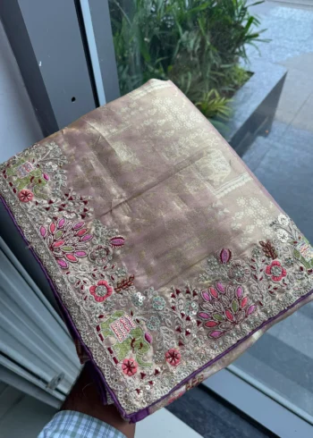 Salmon Royal Hathi Pure Kanjivaram Silk Heavy Embroidered Bridal Saree in hand