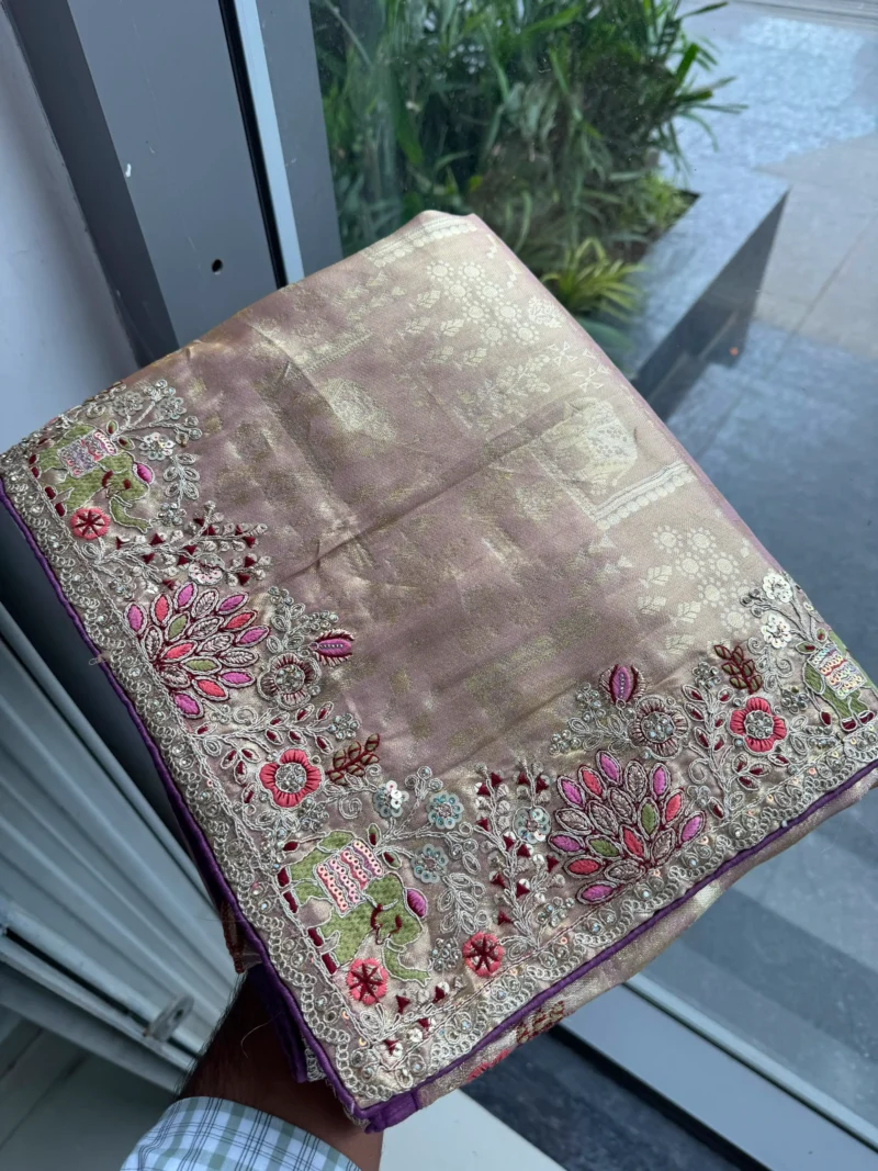 Salmon Royal Hathi Pure Kanjivaram Silk Heavy Embroidered Bridal Saree in hand