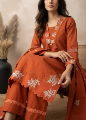 Rust Orange 60-60 Cotton Embroidered Kurta Pant Set with Dupatta sitting pose