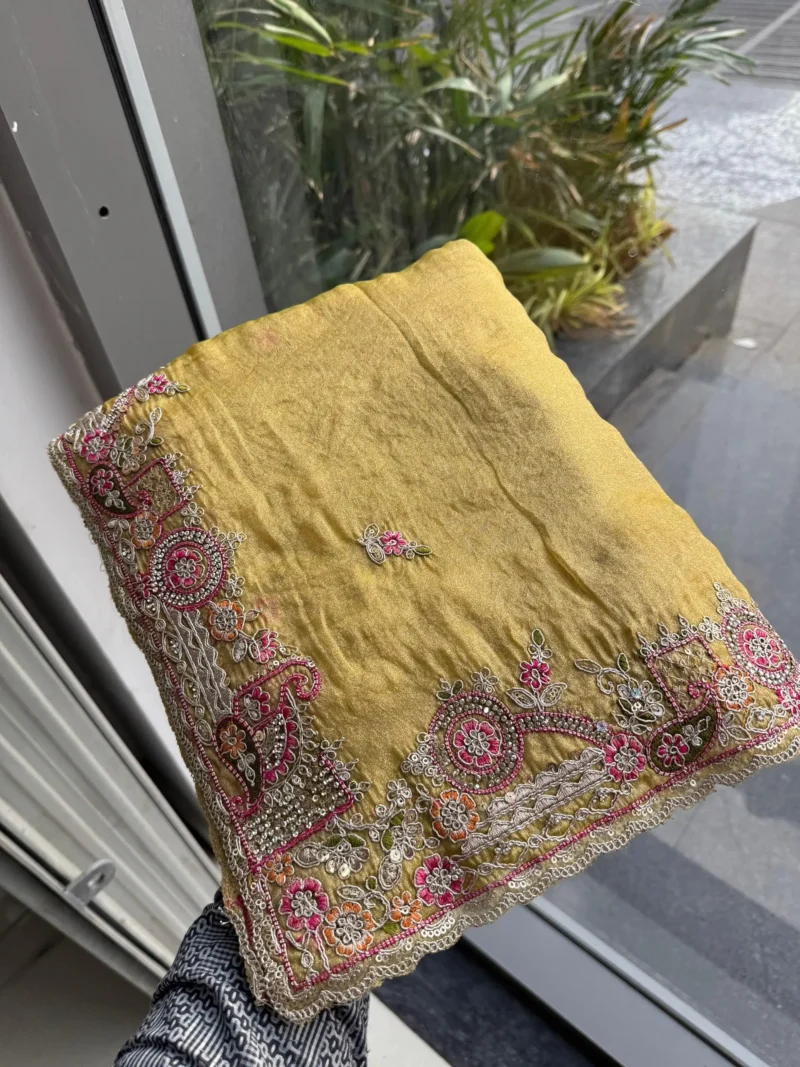 Yellow Fendy Satin Silk Wedding Saree with Embroidered Cutwork Border in hand