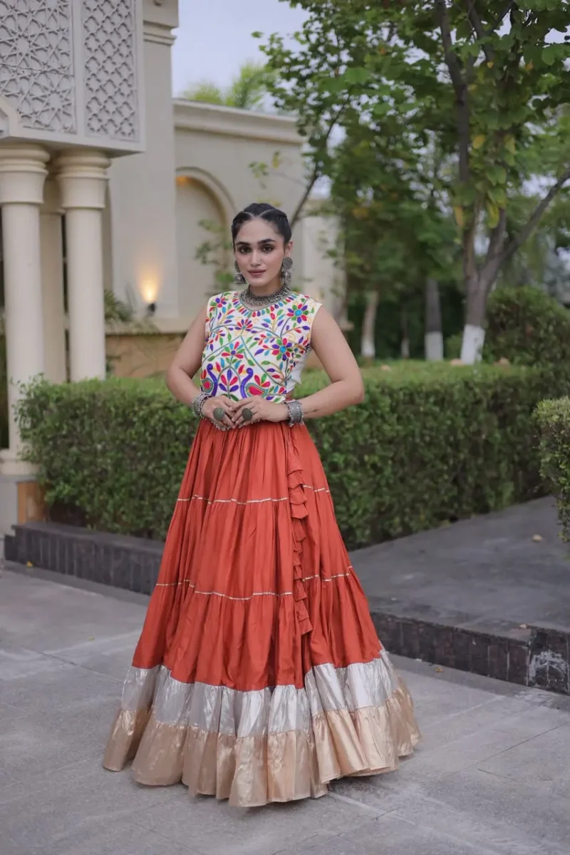 Rust Orange Rayon Navratri Lehenga Choli with Kutchi Work front look