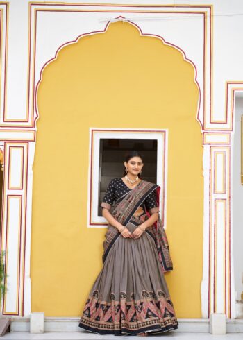 Black Colour Tasar Silk traditional temple wear lehenga with printed detailing and lace border front look