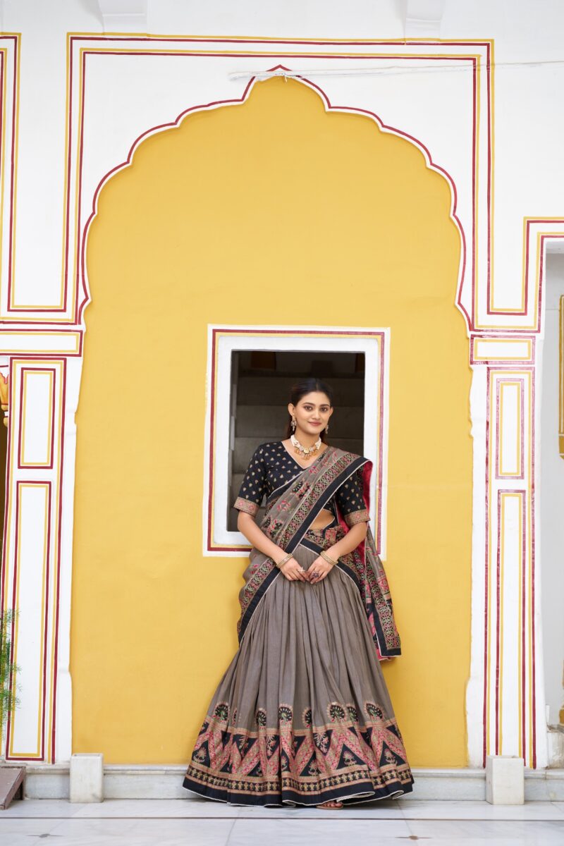 Black Colour Tasar Silk traditional temple wear lehenga with printed detailing and lace border front look