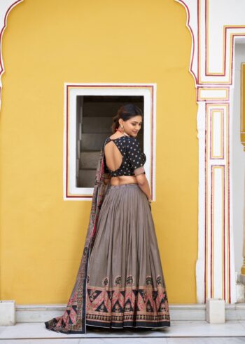 Black Colour Tasar Silk traditional temple wear lehenga with printed detailing and lace border back design