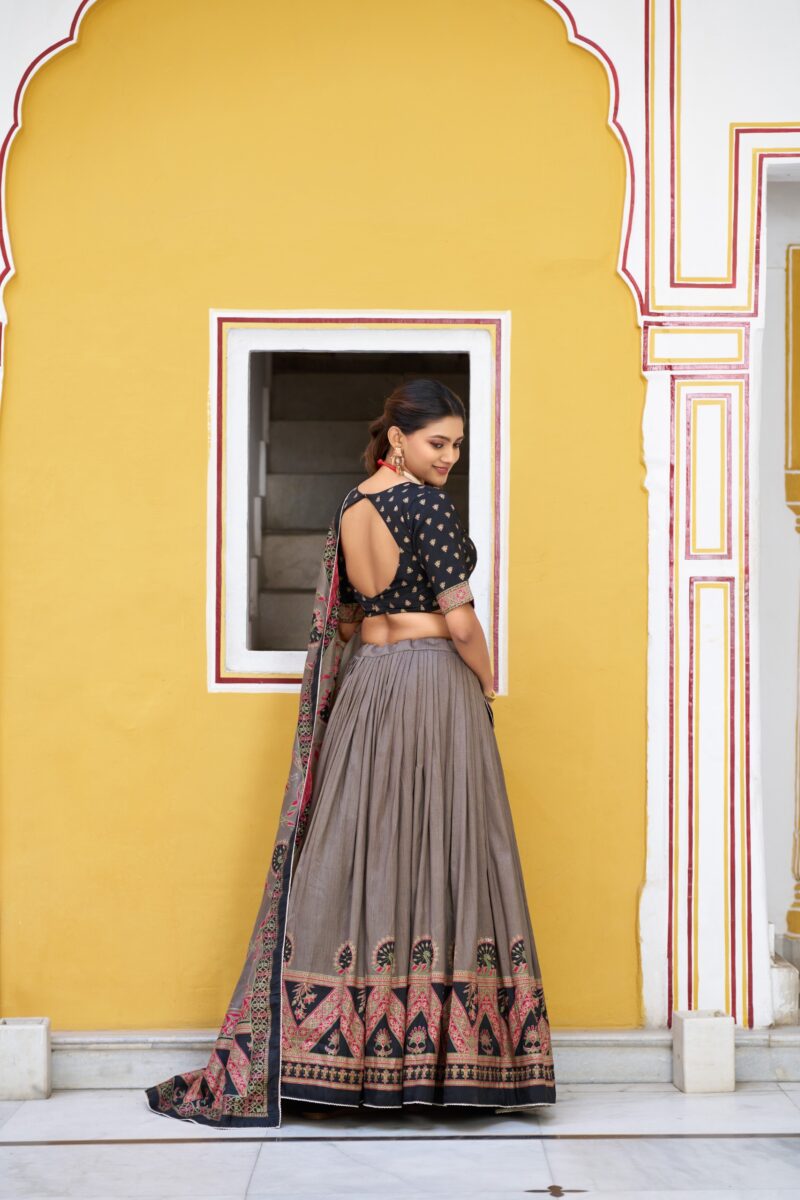 Black Colour Tasar Silk traditional temple wear lehenga with printed detailing and lace border back design