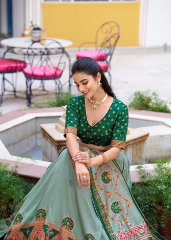 Green Colour Tasar Silk traditional temple wear lehenga with printed detailing and lace border close look