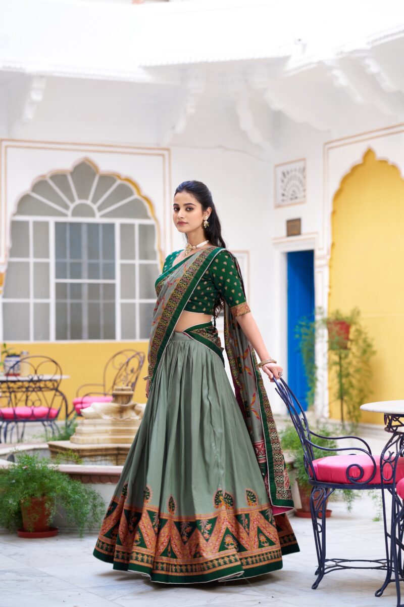 Green Colour Tasar Silk traditional temple wear lehenga with printed detailing and lace border